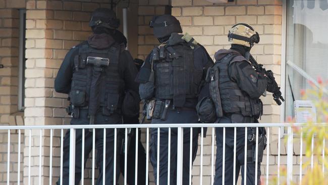 SERT officers at the entrance to the unit. Pic: Marc Robertson