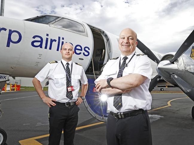 Captain Zac Borromeo and chief pilot Malcolm Sharp at Hobart Airport. Picture: Zak Simmonds