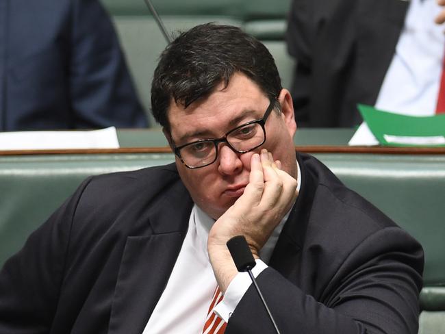 Coalition MP George Christensen listens to Australia's Prime Minister Malcolm Turnbull delivering the Closing the Gap report in the House of Representatives at Parliament House in Canberra, Tuesday, Feb. 14, 2017. (AAP Image/Lukas Coch) NO ARCHIVING