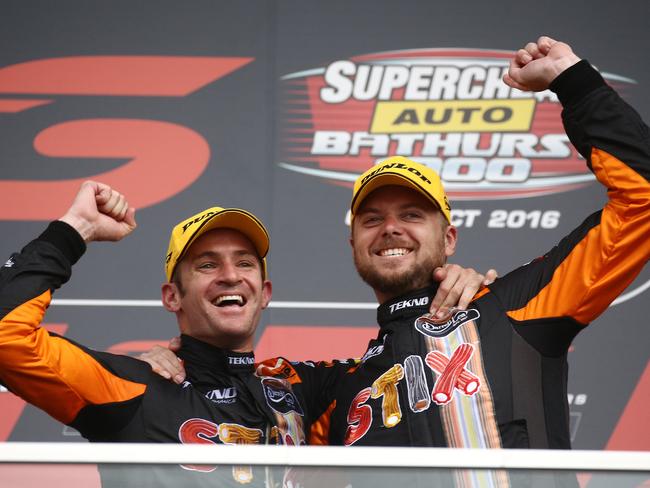 Will Davison and Jonathon Webb raise their fists in triumph.