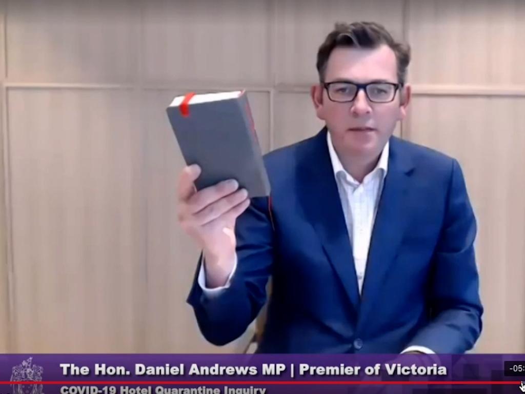 Daniel Andrews with the bible as he was sworn in on Friday.