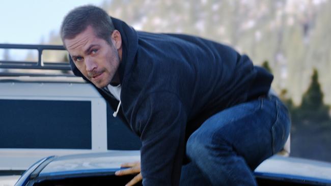 <b>The late Paul Walker doing what he did best in <i>Fast and Furious 7</i>. </b>