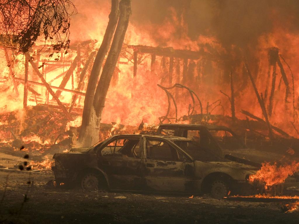 A wildfire burns a structure near Malibu Lake. Picture: AP Photo/Ringo H.W. Chiu