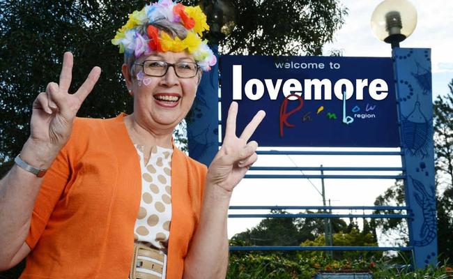 FEEL THE LOVE: Lismore Mayor Jenny Dowell beside a ‘welcome to Lismore’ – err, ‘lovemore’ – sign on the Ballina Rd roundabout outside The Northern Star’s Goonellabah offices. Lismore Council will not be changing the signs around Lismore - that's just a bit of digital mischief from us. Picture: Patrick Gorbunovs Digital Mischief Isobel Rodgers