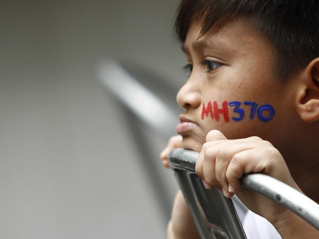 A Malaysian child has his face painted with MH370 during a remembrance event for the ill fated Malaysia Airlines Flight 370 in Kuala Lumpur, Malaysia. Picture: AP