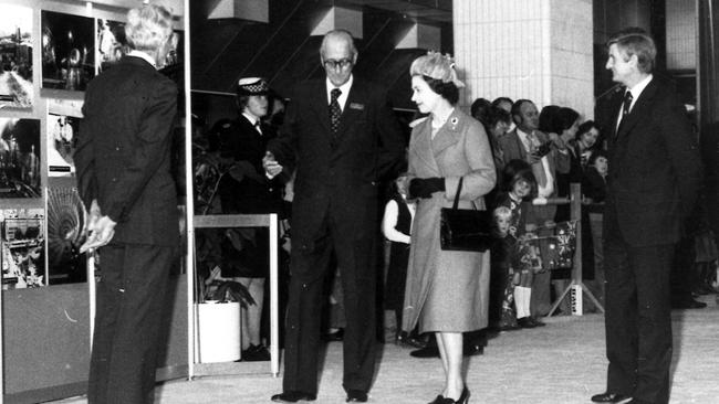 The Queen walks through one of Melbourne's as yet unopened underground railway stations in 1980.