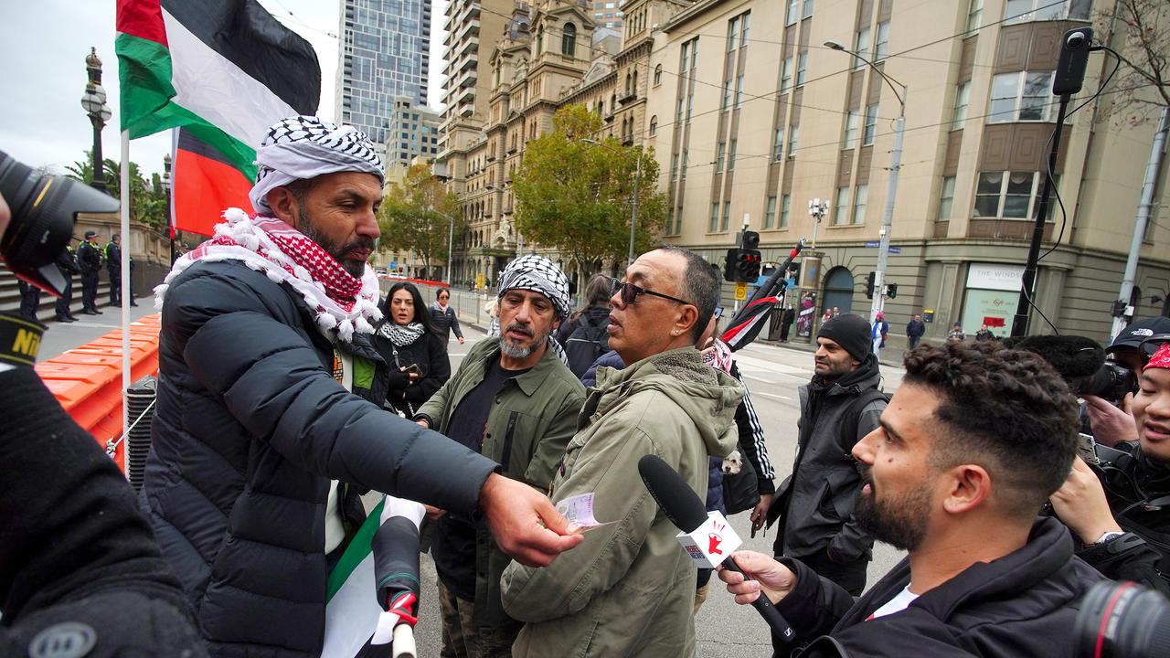 Right-wing commentator Avi Yemeni, bottom right, was seen at the event. Picture: NCA NewsWire / Luis Enrique Ascui