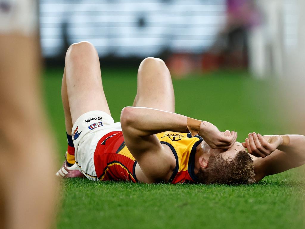 MELBOURNE, AUSTRALIA – JULY 19: Jordan Dawson of the Crows is seen injured during the 2024 AFL Round 19 match between the Essendon Bombers and the Adelaide Crows at Marvel Stadium on July 19, 2024 in Melbourne, Australia. (Photo by Michael Willson/AFL Photos via Getty Images)