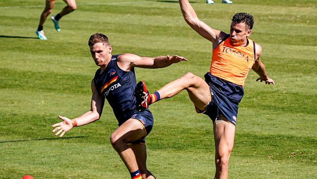 Rory Laird, left, goes head-to-head with Paul Seedsman at Crows training in January. Picture: Mike Burton