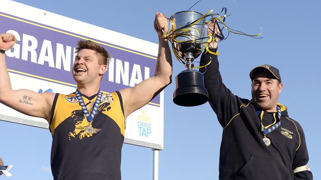 Whittlesea captain Andrew Fairchild and coach Brad Dean after their team’s grand final victory over Lalor in 2015. Picture: Josie Hayden