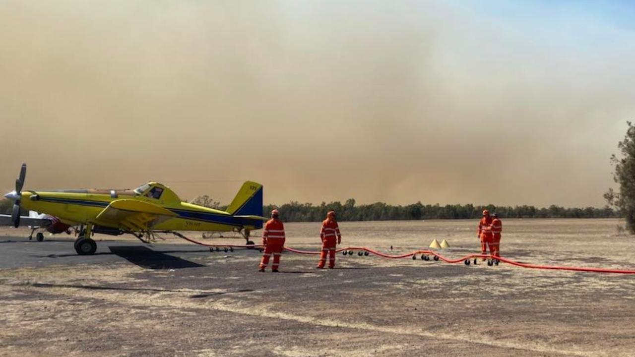 The Bougoure's deliver firefighting foam to fireys at Tara airport as they work to fight the blaze with water bombers. Picture: Sophie Bougoure