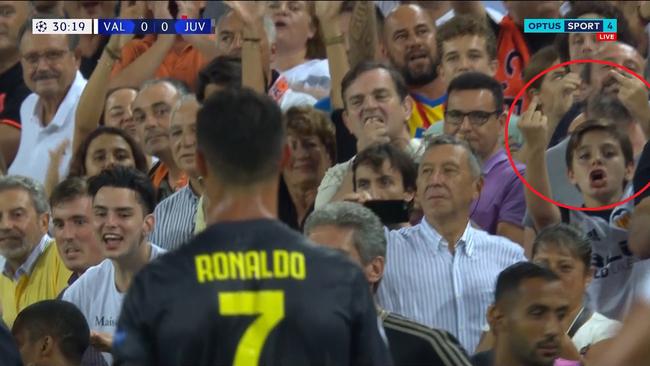 A young fan lets Ronaldo know what he thinks of him after the star's red card in the Champions League