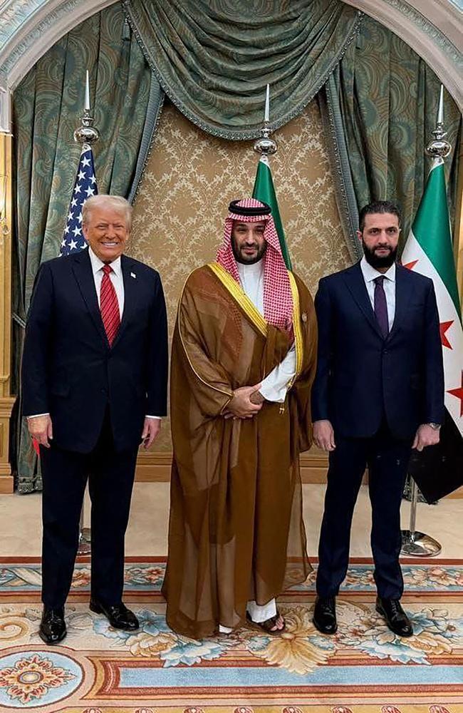 Trump poses with Saudi Crown Prince Mohammed bin Salman and Syria’s interim president Ahmed al-Sharaa in Riyadh on Wednesday. Picture: AP