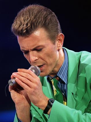 True gentleman ... David Bowie says a prayer for Freddie Mercury in 1992. Picture: AFP