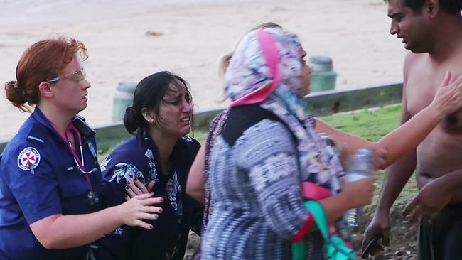 Devastated relatives at Moonee Beach. Picture: Frank Redward