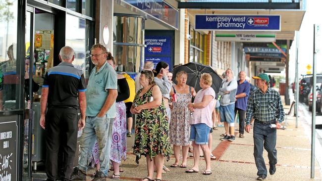 Kempsey residents line up at the IGA for supplies at the only supermarket left open. Picture: Nathan Edwards