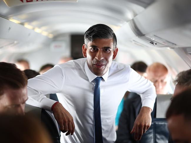 IN AIR, UNITED KINGDOM - MAY 24: Britain's Prime Minister and Conservative Party leader Rishi Sunak speaks to journalists on the plane on their way to Staffordshire on May 24, 2024 in the air, United Kingdom. After much speculation across the UK media, Sunak announced yesterday that the UK General Election will be held on July 4th.  (Photo by Henry Nicholls - WPA Pool/Getty Images) *** BESTPIX ***