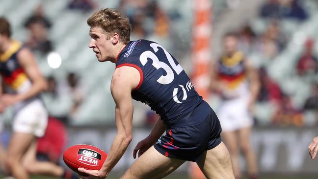 Dylan Stephens readies himself to handball during SANFL finals.