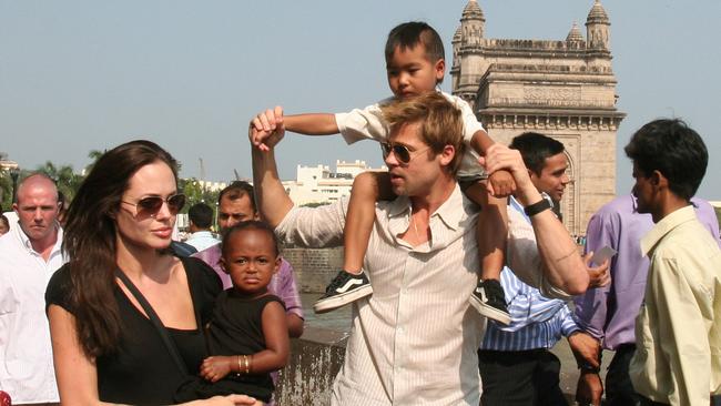 The Jolie-Pitt family travelling through India in a happier time. Maddox is on Pitt’s shoulders however, now aged 15, recently had to step in the middle of his parents’ fight.