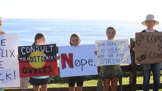 Members of the public took part in a paddle-out at Byron Bay's Main Beach to protest against the planned Netflix reality show Byron Baes on the morning of Tuesday, April 20, 2021. Picture: Liana Boss