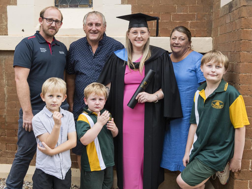 Bachelor of Human Services (Distinction) graduate Veronika Ziesemer with family (from left) Denver Wood, Lucas Wood, Mark Ziesemer, Roman Wood, Lyn Ziesemer and Kaleb Ziesemer at a UniSQ graduation ceremony at Empire Theatres, Tuesday, February 13, 2024. Picture: Kevin Farmer