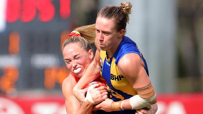 Emma Swanson of the Eagles is tackled by Leah Kaslar of the Suns during the Round 6 AFLW match between the West Coast Eagles and Gold Coast Suns at Mineral Resources Park in Perth, Sunday, March 14, 2020. (AAP Image/Richard Wainwright) NO ARCHIVING, EDITORIAL USE ONLY