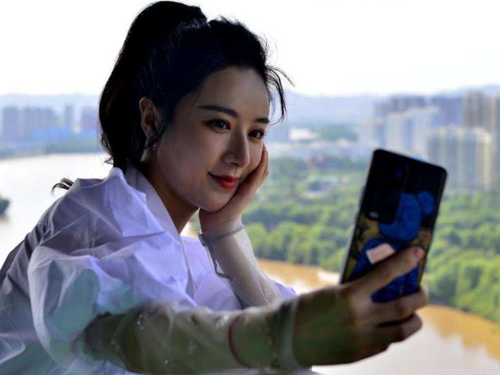 E-commerce livestreaming anchor Viya takes a selfie at Yellow River Building during her China tour on July 4, 2021 in Lanzhou, Gansu Province of China. (Photo by VCG/VCG via Getty Images)