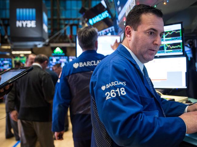 NEW YORK, NY - DECEMBER 04: A trader works on the floor of the New York Stock Exchange during the afternoon of December 4, 2015 in New York City. The market closed more than 370 points up due to positive jobs report data. Andrew Burton/Getty Images/AFP == FOR NEWSPAPERS, INTERNET, TELCOS & TELEVISION USE ONLY ==
