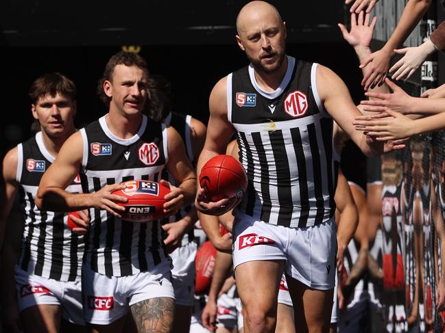 Magpies players run onto the field during the elimination final SANFL match between Central District and Port Adelaide at Adelaide Oval in Adelaide, Sunday, September 3, 2023. (SANFL Image/David Mariuz)