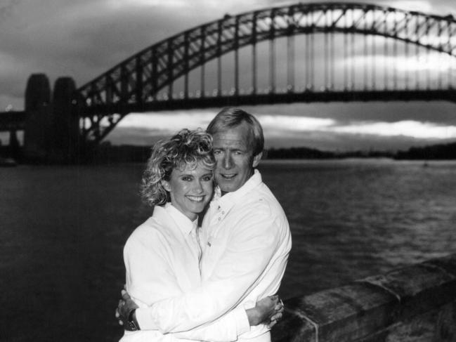 Singer and actress, Olivia Newton-John, and comedian, Paul Hogan, on the lawns of Admiralty House, Kirribilli.