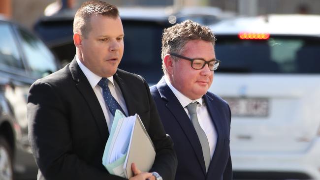 Shane Gibbs, a former SAS soldier (right), arrives for sentencing at Southport Court with David Garratt of Howden Saggers lawyers (left). Picture Glenn Hampson.