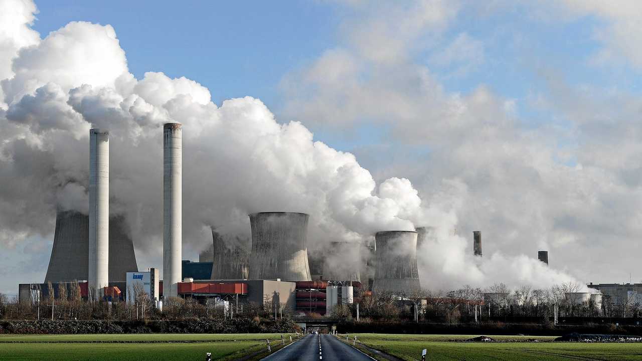 Steam rises from a coal-fired power plant. Picture: SASCHA STEINBACH