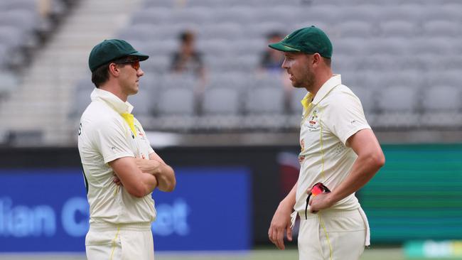 Australian captain Pat Cummins (L) and fellow fast bowler Josh Hazlewood talk during the Perth Test. Picture: AFP