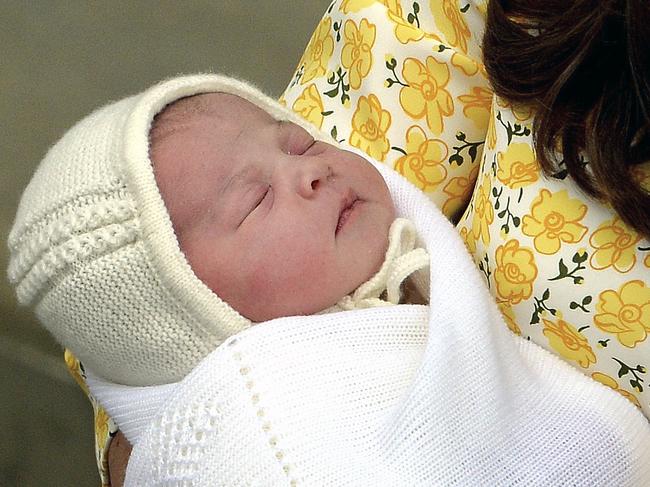 Kate, Duchess of Cambridge holds her newborn baby princess, as she poses for the media on the steps of The Lindo Wing of St. Mary's Hospital, London, Saturday, May 2, 2015. Kate, the Duchess of Cambridge, gave birth to theri second child, a baby girl on Saturday morning. (John Stillwell/Pool via AP)