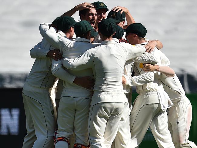 Australian players celebrate their special Boxing Day Test victory.