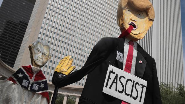 Left-wing demonstrators in Chicago at the weekend targeted Donald Trump and US Attorney General Jeff Sessions. Picture: AFP