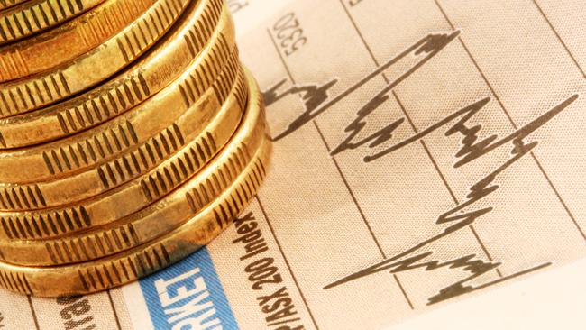 A stack of gold coins on a finance page stock market index graph. ASX investing Australian money generic