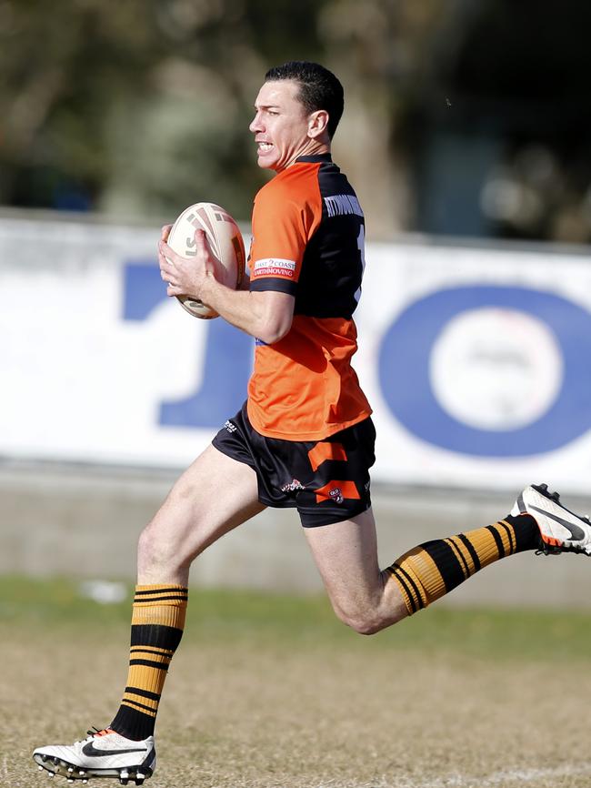 Southport's Drumayne Dayberg--Muir in action from the Bycroft Cup match between Runaway Bay and Southport (orange) at Bycroft Oval, Runaway Bay.