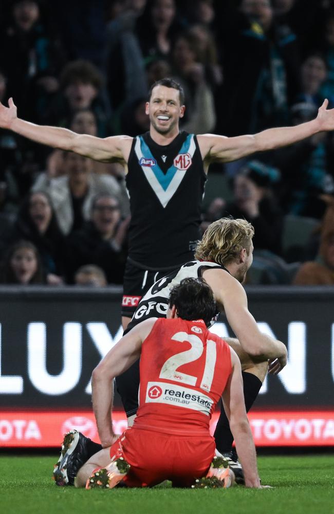 ADELAIDE, AUSTRALIA - AUGUST 03: Travis Boak of the Power celebrates a goal watched by Errol Gulden of the Swans during the round 21 AFL match between Port Adelaide Power and Sydney Swans at Adelaide Oval, on August 03, 2024, in Adelaide, Australia. (Photo by Mark Brake/Getty Images)