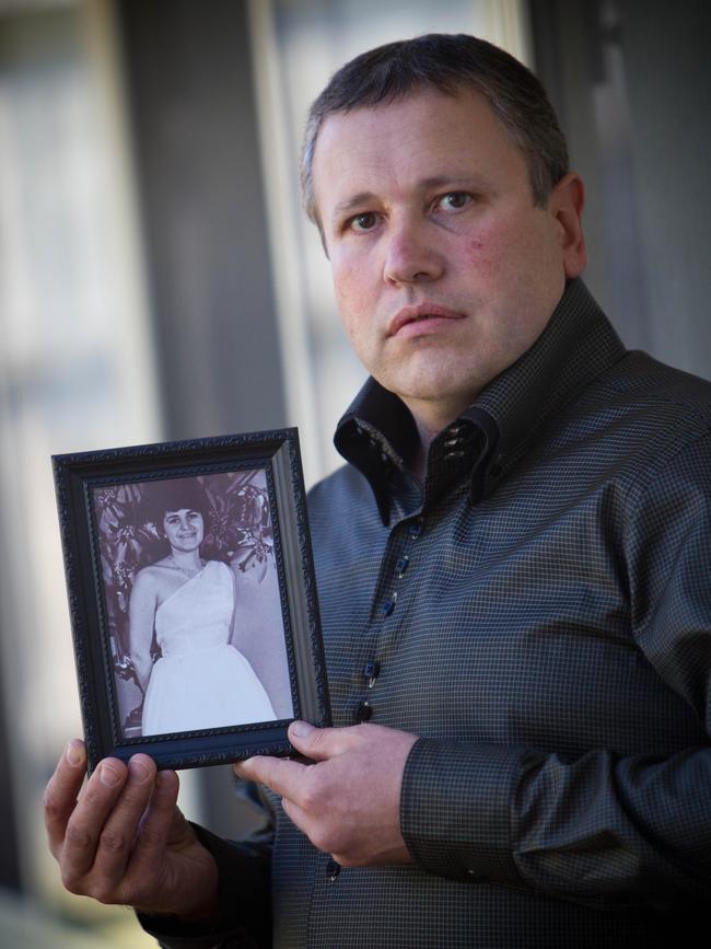 Mark James with a picture of his murdered mother Maria James. Picture: Scott Chris 