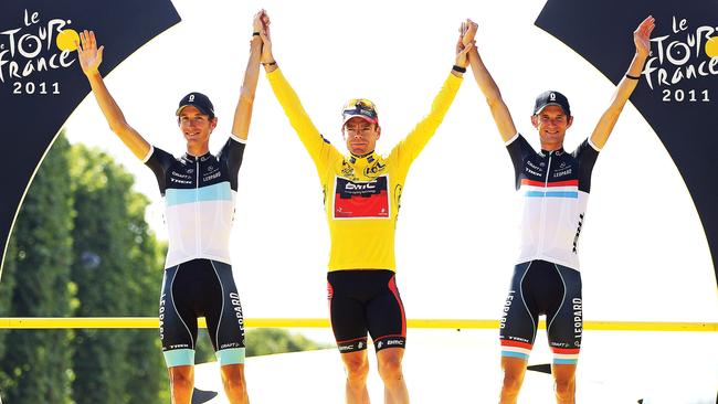 On the podium in Paris after winning the 2011 Tour de France, flanked by Andy Schleck (left) and Frank Schleck. Picture: Getty Images