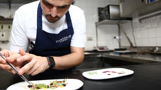 Head chef Victor Moya plates up the parmesan gel salad.