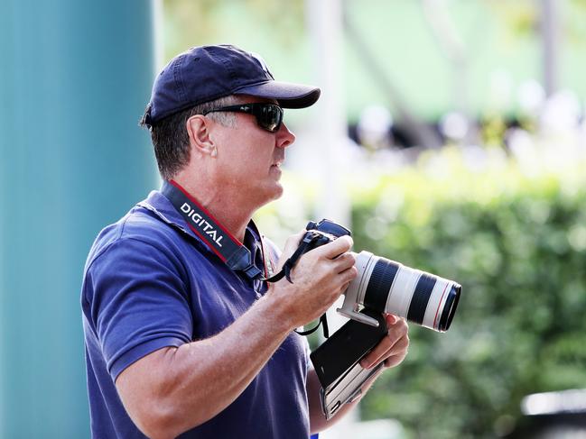 Monteiro tries his hand at press photography ahead of his appearance at Gosford Local Court on an AVO and intimidation charge. (AAP Image/Sue Graham)