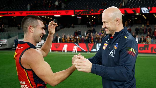 MELBOURNE, AUSTRALIA - JULY 19: Josh Rachele of the Crows and Matthew Nicks, Senior Coach of the Crows celebrate during the 2024 AFL Round 19 match between the Essendon Bombers and the Adelaide Crows at Marvel Stadium on July 19, 2024 in Melbourne, Australia. (Photo by Michael Willson/AFL Photos via Getty Images)