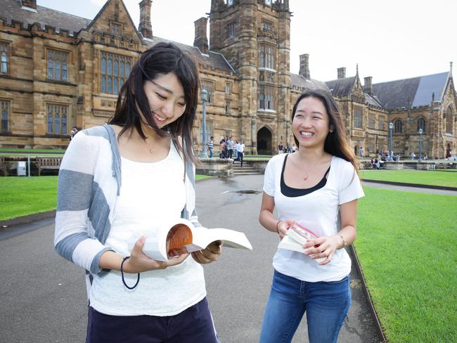 16/03/16 Moepko Nakao ( Japan) and Wanyi Zhong ( China) International students at Sydney University with phoenic reading books by Readable English. Pic Renee Nowytarger / The Australian.