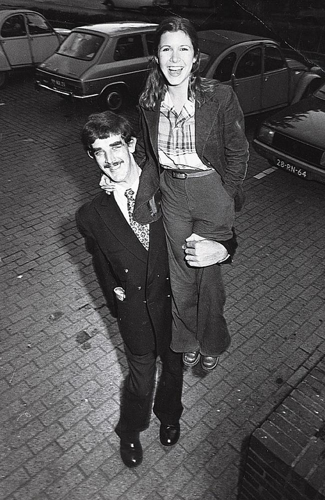 Carrie Fisher on the shoulders of Peter Mayhew who plays Chewbacca. Photo from invaluable.com from Carrie Fisher's personal collection