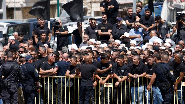 Israeli security hold back demonstrators during a visit to Majdal Shams by Israeli Prime Minister Benjamin Netanyahu. Picture: AFP.