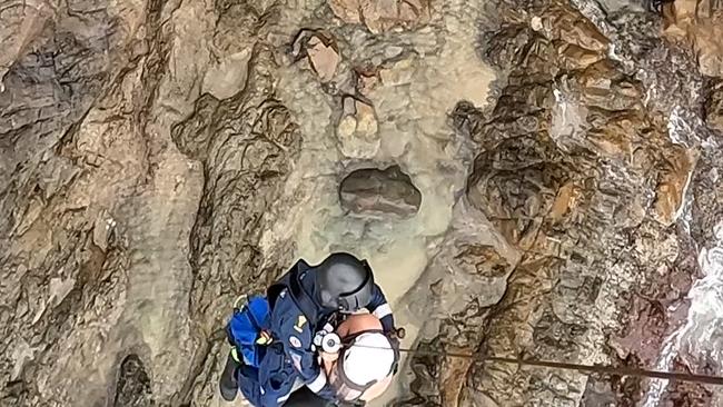 A tourist fell up to eight metres from a Noosa National Park cliffe face onto rocks on Tuesday. Picture: RACQ LifeFlight