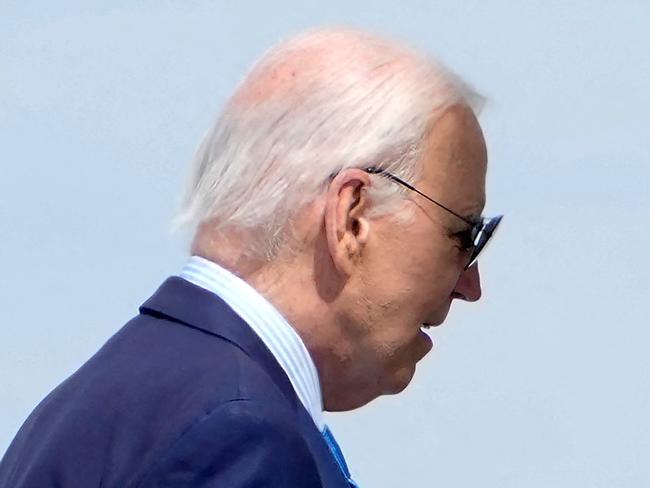 TOPSHOT - US President Joe Biden boards Air Force One as he departs Harry Reid International Airport in Las Vegas, Nevada, on July 17, 2024, en route to Delaware. US President Joe Biden is experiencing "mild symptoms" after testing positive for Covid during a campaign trip to Las Vegas on Wednesday, the White House said. (Photo by Kent Nishimura / AFP)