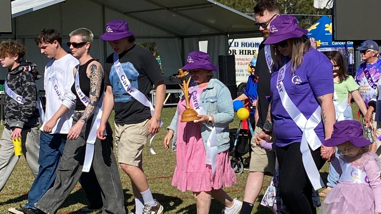 The family of Councillor Neil Fisher lead the 2024 Rockhampton Relay for Life survivor and carers lap.